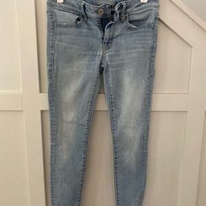AE size 4 Blue Skinny Jeans with Faded Distress